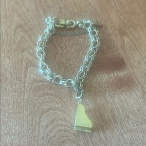 Vintage Monet Gold Colored Clasped Bracelet With Piano Charm